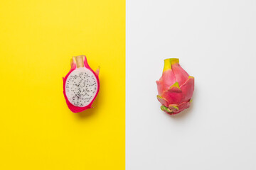 fresh dragon fruit of pitahaya, tropical exotic fruit on colorful surface isolated, minimalism concept with copy space