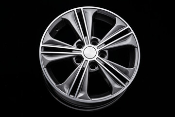 Obraz premium grey beautiful modern aluminum alloy wheel on black background