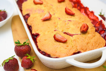step by step recipe strawberry cobbler homemade from ripe fresh strawberries and shortbread on a light background, top view