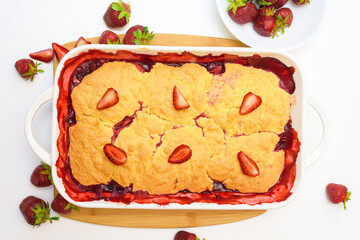 step by step recipe strawberry cobbler homemade from ripe fresh strawberries and shortbread on a light background, top view
