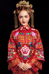 Fototapeta premium Asian ancient sexy bride in red dress in black background