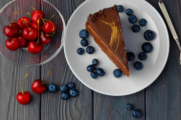 Piece of chocolate cake served with fresh berries
