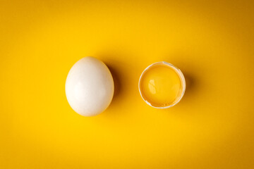 White egg on yellow background.