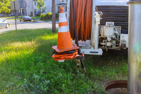 Machine For Cleaning Sewer Wells In The A Town Street.