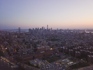 Naklejka na ściany i meble Wide Aerial Drone View of Manhattan Skyline in New York City at Dusk 