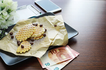 Fototapeta na wymiar Viennese waffles with filling. Coffee table. A set of fragrant cookies for breakfast for the holiday.