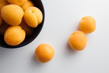 Close-up of ripe peaches on the table. Ripe peaches with leaves