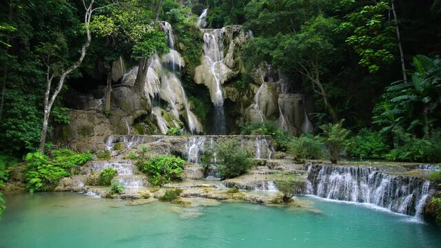 Kuangsi Waterfall. The upper levels of the falls are enveloped by lush jungle near Luang Prabang, Laos