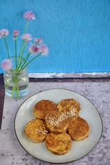 Slices of tempeh (fermented soybean) on the wooden board