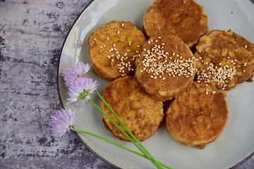 Slices of tempeh (fermented soybean) on the wooden board