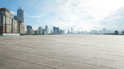 Wide empty concrete floor with  cityscape view