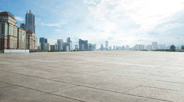 Fototapeta Wide empty concrete floor with  cityscape view