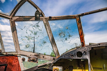 View from the cockpit of old ruined aircraft Antonov An-2 at abandoned Airbase aircraft cemetry in Vovchansk, Kharkov region, Ukraine.