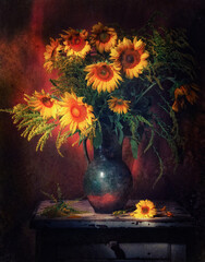Classic still life with bouquet of beautiful yellow sunflowers in old vintage jug in a ray of light...