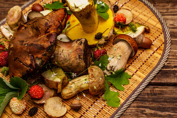Fresh forest mushrooms. Assorted gourmet porcini and boletus, oak leaves, strawberries