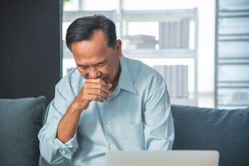 Fototapeta premium Senior adult Asian father is suffering from coughing, discomfort from prolonged bacterial viral infections. Health care concepts