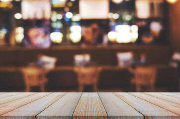 wooden table with abstract blurred background resturant lights used for display montage products mock up design.