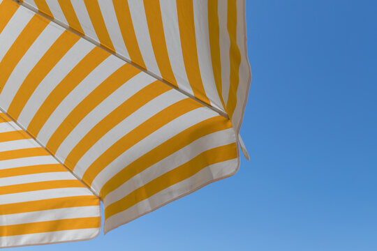sunshade in front of blue sky