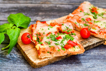  Assorted sliced italian roman   style pizza.  with parmesan cheese,  ham,  mushrooms and tomato sauce 
