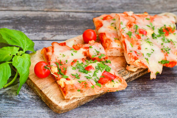  Assorted sliced italian roman   style pizza.  with parmesan cheese,  ham,  mushrooms and tomato sauce 
