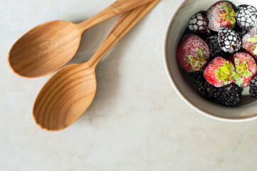 Frozen red fruits. Strawberries and blackberries