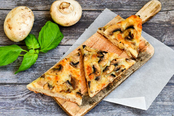 Slice of home made italian mushroom pizza
