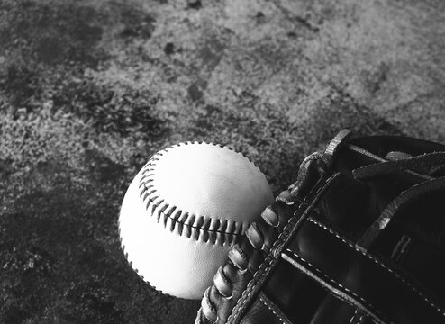 Baseball glove with ball for sports background in black and white.