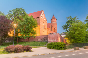 Fototapeta na wymiar Gothic castle of Warmian Bishops in the evening in Olsztyn, Poland.