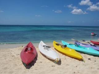 colorful kayaks on a tropical  beach