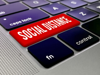 Fototapeta premium Social distancing key on a laptop keybord