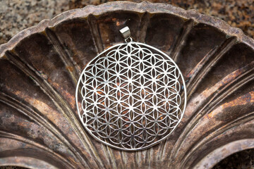 Silver metal pendant in the shape of flower of life