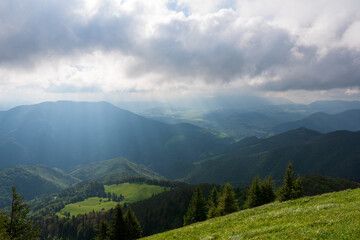 Green meadow in mountain and blue cloud sky. Composition of nature. Spring meadow. Composition of nature. Slovakia