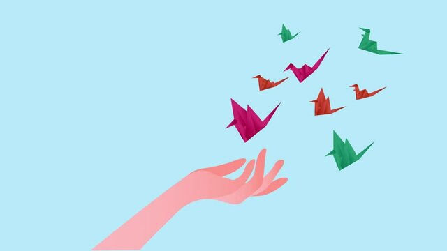 Human hand animation letting go origami birds