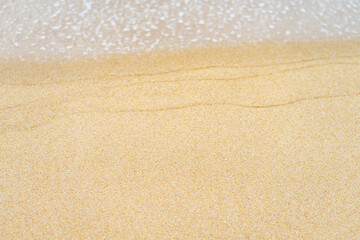 close up sand beach with blue sea wave background