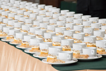 Coffee break at conference meeting. Set of coffee break arranged on the table.