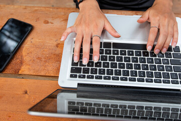 Fototapeta premium Beautiful young woman working on laptop.
