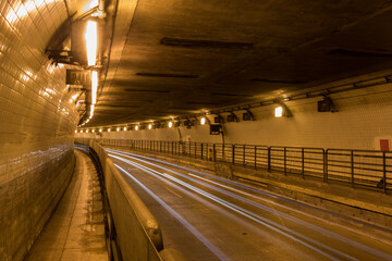 Car light trails inside Posey Tube, an underwater tube tunnel connecting the cities of Oakland and Alameda, California.
