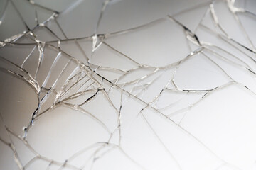 Mobile smartphone with broken glass lcd touch screen on white background.