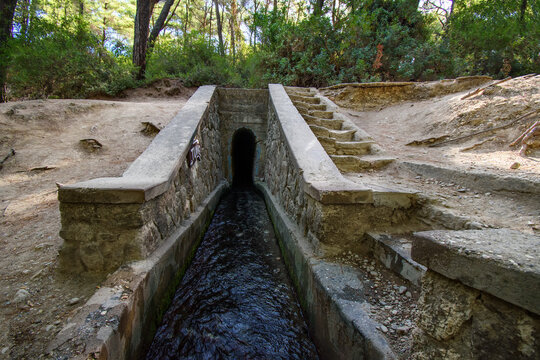 Entrance to tunnel on Loutanis river in Seven spring (Epta Piges) in forest near Kolymbia (Rhodes, Greece)