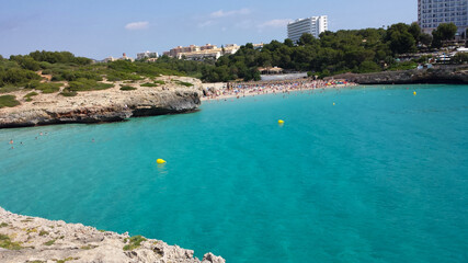 Fototapeta na wymiar People in the water on Cala Domingos Beach, Calas de Mallorca, Spain