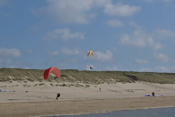 Paragliding at the beach of Katwijk aan Zee. Paraglider's making use of updraft of the dunes to stay in the air 