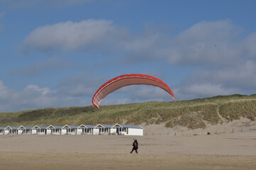 Paragliding at the beach of Katwijk aan Zee. Paraglider's making use of updraft of the dunes to stay in the air 