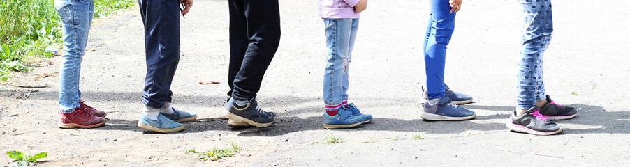 Children's feet, the company of children at the stadium