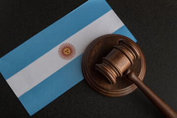 Lawyers wooden gavel on Argentina flag background. Court in Argentina.