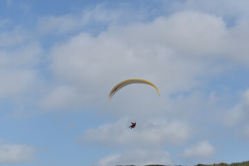 Paragliding at the beach of Katwijk aan Zee. Paraglider's making use of updraft of the dunes to stay in the air 