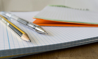 front view background of notebooks, pencils and pens