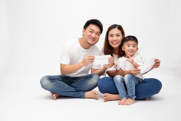 Asian family holding protective mask for prevent virus