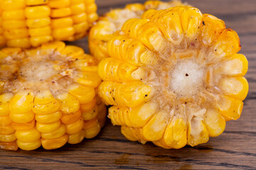 Fried corn on fire with spices and salt