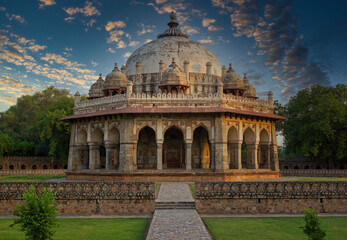 Fototapeta premium Islamic architecture tomb in Lodhi garden against dramatic sunset located in New Delhi, India