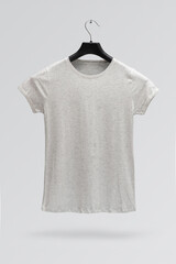 Front side of female grey melange cotton t-shirt on a hanger isolated on a grey background. T-shirt without print.